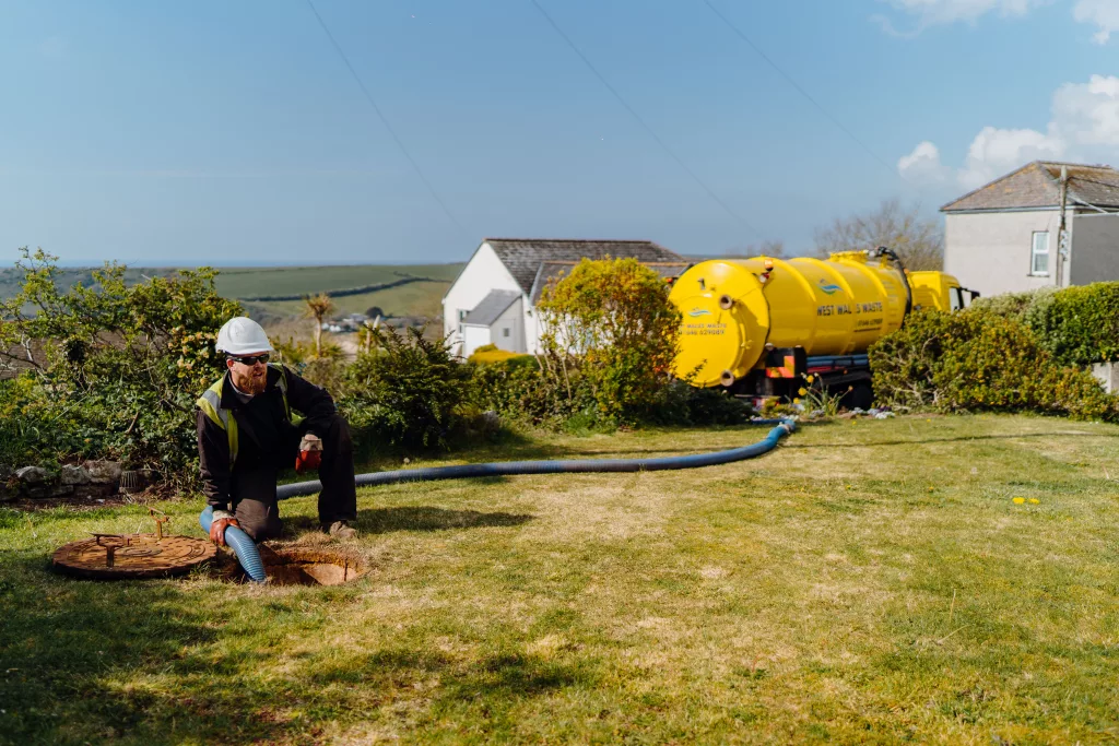 West Wales Waste engineer emptying a septic tank while overlooking a Pembrokeshire Coastline