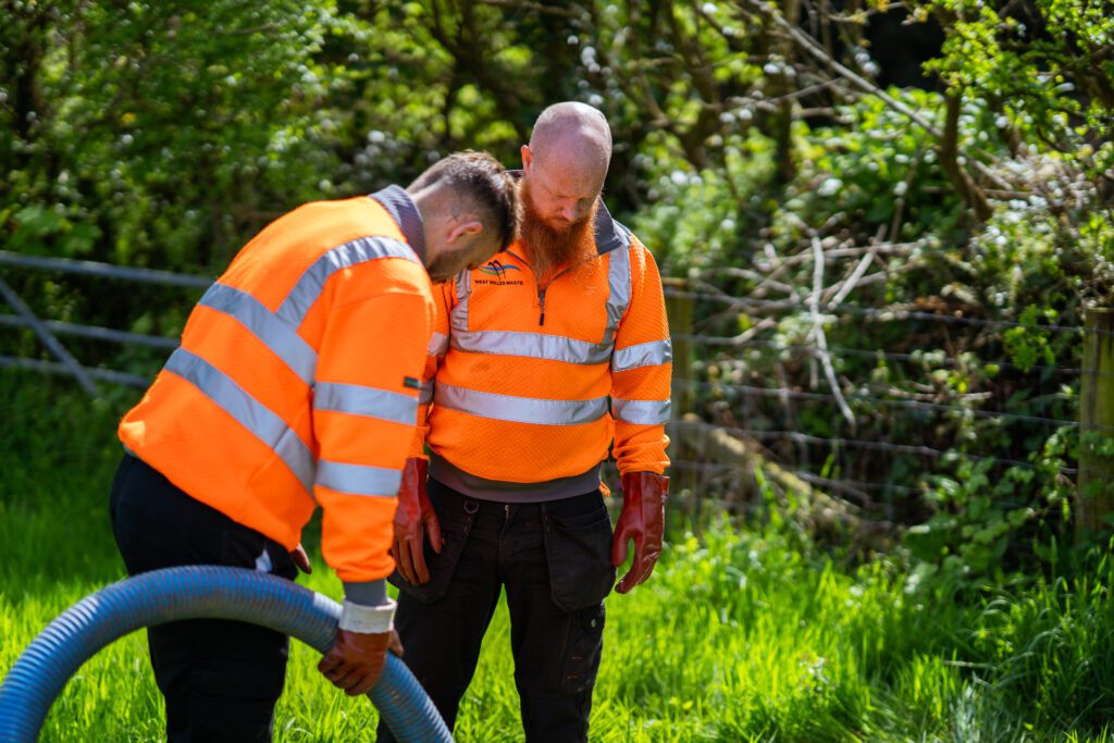 West Wales Waste team emptying septic tank at farm in Nolton Haven, Pembrokeshire - alternative view